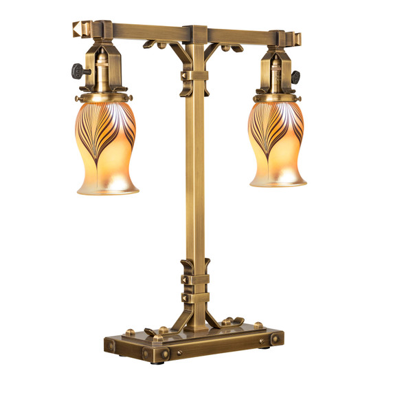  A stout and burly Arts & Crafts or Craftsman table lamp with an aged brass finish and curvy, blown glass shades.