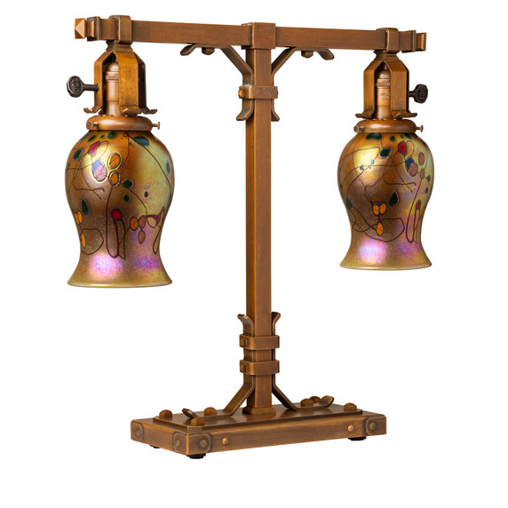  A stout and burly Arts & Crafts or Craftsman table lamp with an aged finish and tulip shaped blown glass poppy shades.