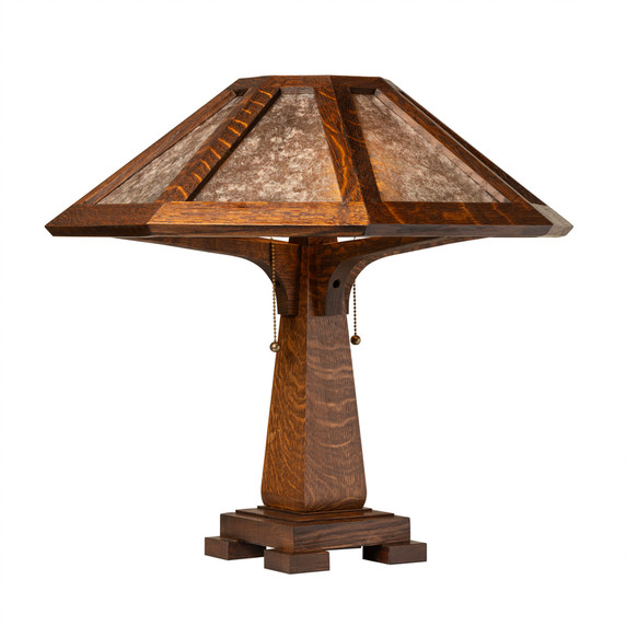  Arts & Crafts table lamp with octagonal mica shade showcasing quarter-sawn oak construction, geometric framework, and period-perfect lighting design for historically-inspired interiors.