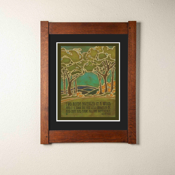  Arts & Crafts style print by Julie Leidel featuring stylized forest landscape with stained glass-like outlines depicting two diverging paths through trees, in shades of green, turquoise, and amber. The artwork includes Robert Frost's famous quote 