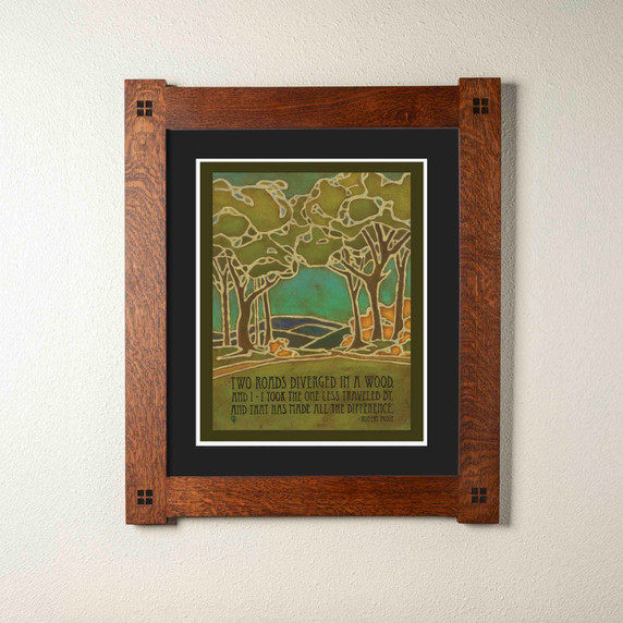  Arts & Crafts style print by Julie Leidel featuring stylized forest landscape with stained glass-like outlines depicting two diverging paths through trees, in shades of green, turquoise, and amber. The artwork includes Robert Frost's famous quote 