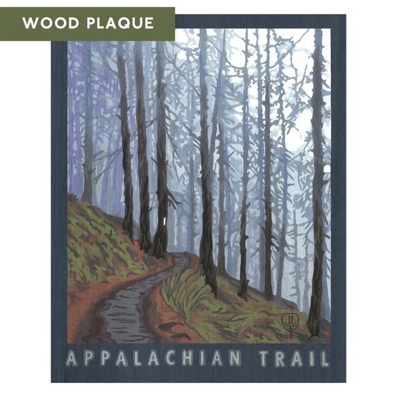  A stylized wood plaque print by Julie Leidel of a misty forest scene with tall trees lining a winding dirt path on a hillside. Soft blue and green tones create a calm, atmospheric view labeled “Appalachian Trail.