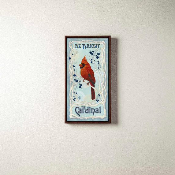  Art canvas print of a cardinal in the snow with a brown float frame.