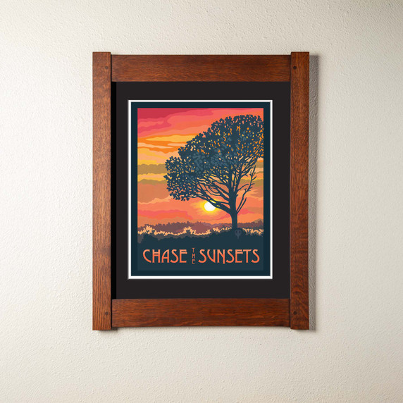 An archival art print of a tree in the sunset with a double mat and mortise and tenon oak frame. 