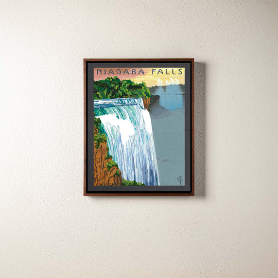  A canvas print of a painting of Niagara Falls. It's in a brown float frame.