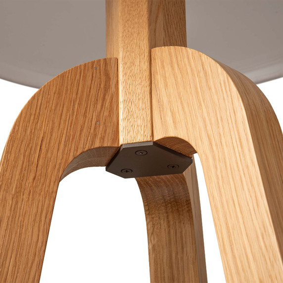  Detail of the underside of the joinery on the body of a three-legged wood Mid-Century Modern floor lamp.