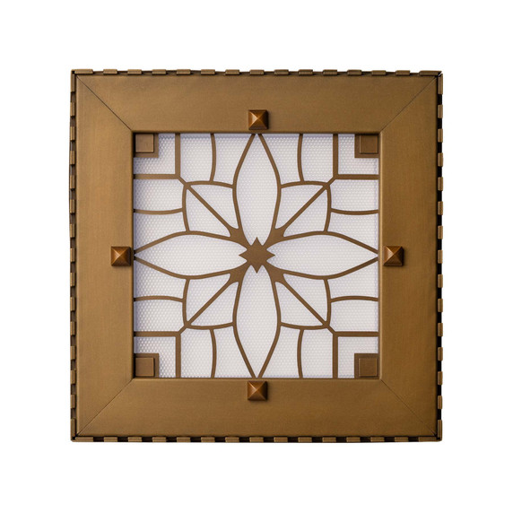 Overhead view of a square can or recessed light cover with a dental pattern and filigree in an antique brass finish.