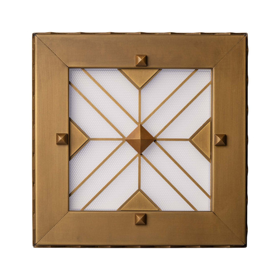  Three-quarters view of a square can or recessed light cover with a stepped pyramid pattern and filigree in an antique brass finish.