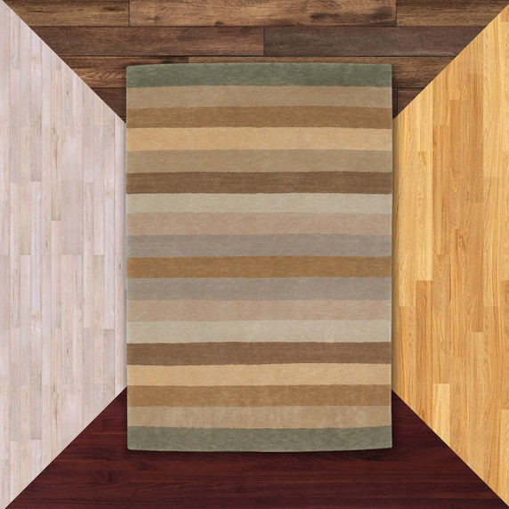  A modern styled striped rug with a brown and green color scheme against floor color samples.