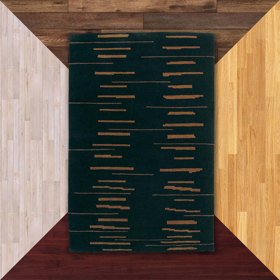  A Modern-era style graphics rug with a rich ebony and burn orange color palette. It is on a background of floor color samples.