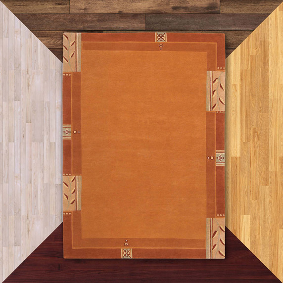 A rectangular, orange Prairie School rug with a grain pattern border. It's on a floor sample color background.