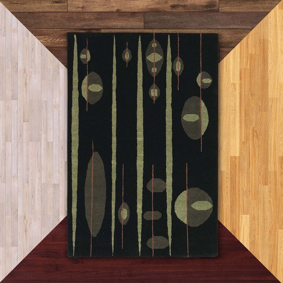  A rectangular black rug with five thick, vertical green stripes in an Atomic style Mid-Century design. It is on a floor color sample background.