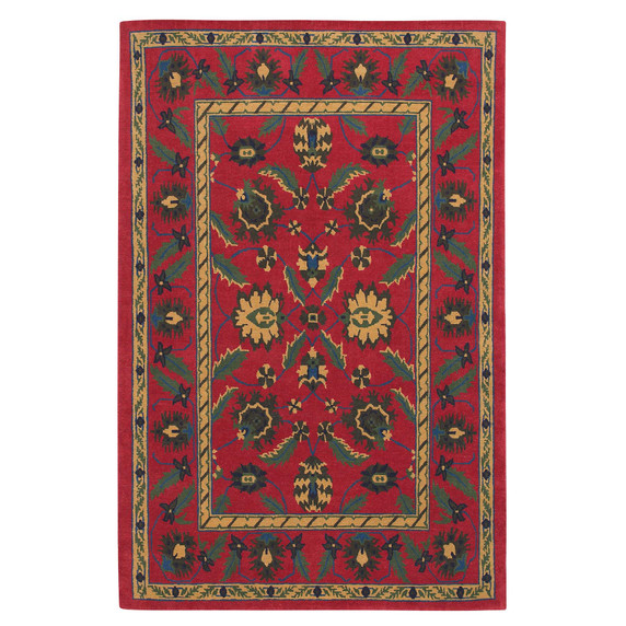  A rectangular oriental red rug with a complex floral pattern. The center is filled with large, symmetrical flower and leaf shapes in green, yellow, and blue.