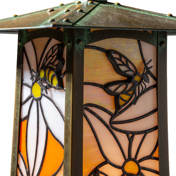  An Asian architecture inspired battery powered table lamp with an orange blossom and honey bee stained glass panel design. 
