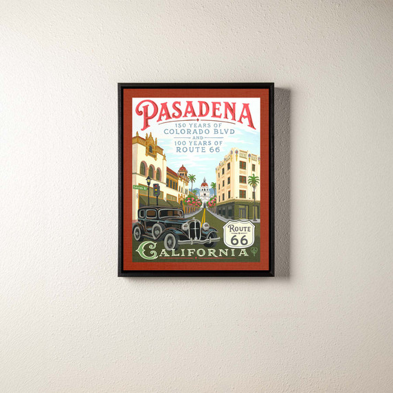  A canvas print of a painting commemorating the anniversaries of Route 66 and Colorado Boulevard in Pasadena, California. It is in a black frame.