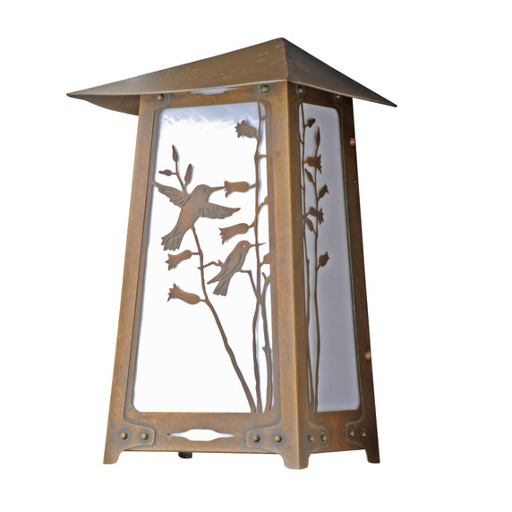  A flush mounted, art nouveau wall sconce light with an aged patina finish, white glass and a hummingbird filigree.