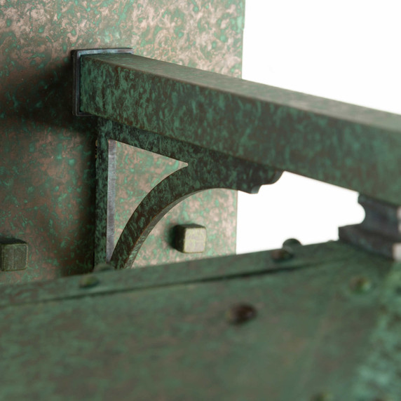  Detail of a rustic, artistic wall mounted light fixture with Japanese Maple artwork, an aged verdigris finish and golden glass.Detail of a rustic, artistic wall mounted light fixture with Japanese Maple artwork, an aged verdigris finish and golden glass.