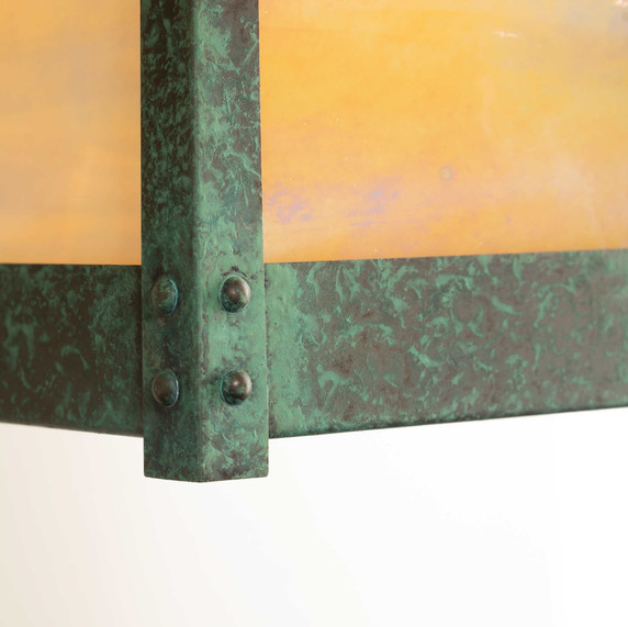  Detail of a rustic, artistic wall mounted light fixture with Japanese Maple artwork, an aged verdigris finish and golden glass.