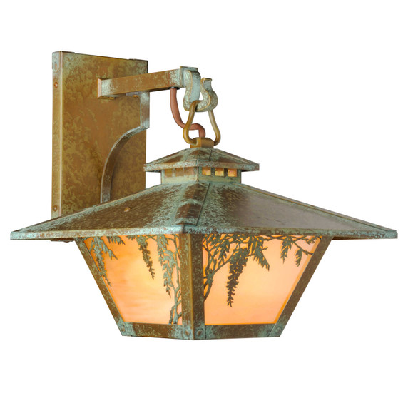  Quarter view of an Arts & Crafts style wall mounted light fixture on a hooked arm with a cupola, a dramatic taper, an aged patina finish and warm glass and wisteria artwork.