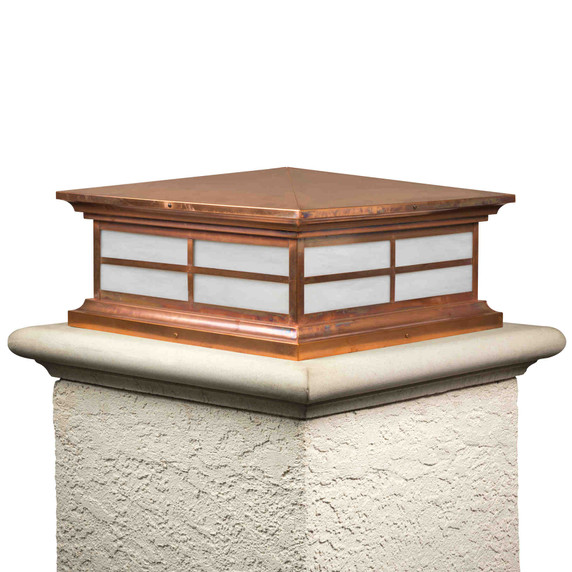  A traditional, neo-Classical column mounted pier light fixture with a window pane design, a raw copper finish and white glass.