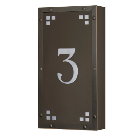  A solid brass, vertically oriented illuminated house number plaque with a single number address, a bronze finish, white glass and corner glass accents.