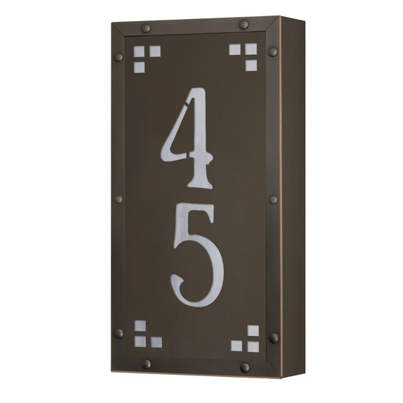  A solid brass, vertically oriented illuminated house number plaque with a two number address, a bronze finish, warm glass and corner glass accents.