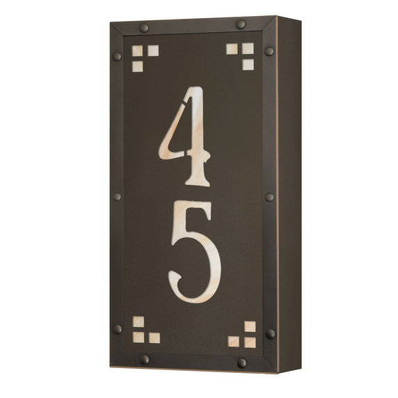  A solid brass, vertically oriented illuminated house number plaque with a two number address, a bronze finish, warm glass and corner glass accents.