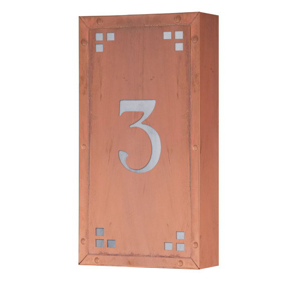  A solid brass, vertically oriented illuminated house number plaque with a single number address, a raw copper finish, white glass and corner glass accents.