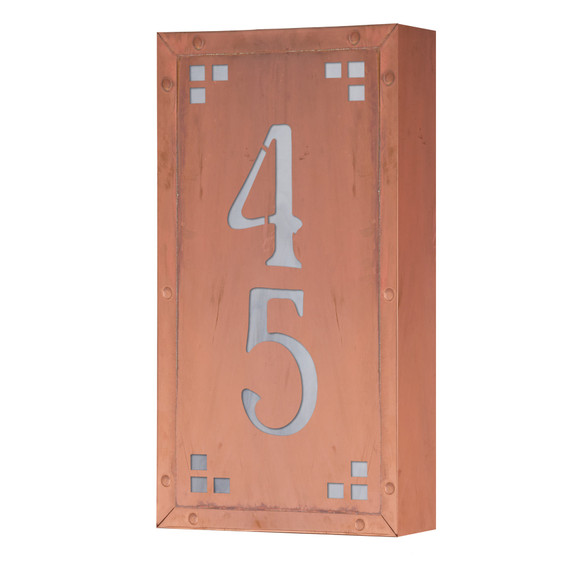  A solid brass, vertically oriented illuminated house number plaque with a two number address, a raw copper finish, white glass and corner glass accents.