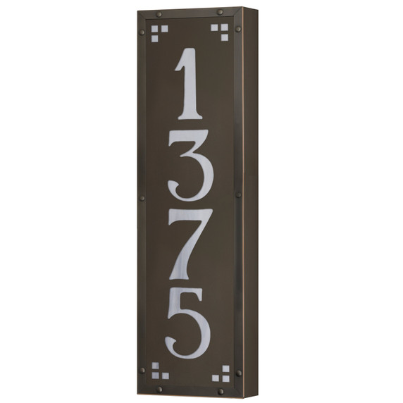  A solid brass, vertically oriented illuminated house number plaque with a four number address, a bronze finish, white glass and corner glass accents.