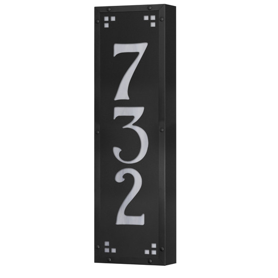  A solid brass, vertically oriented illuminated house number plaque with a three number address, a satin black finish, white glass and corner glass accents.