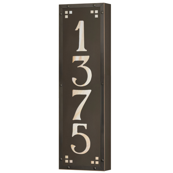  A solid brass, vertically oriented illuminated house number plaque with a four number address, a bronze finish, warm glass and corner glass accents.