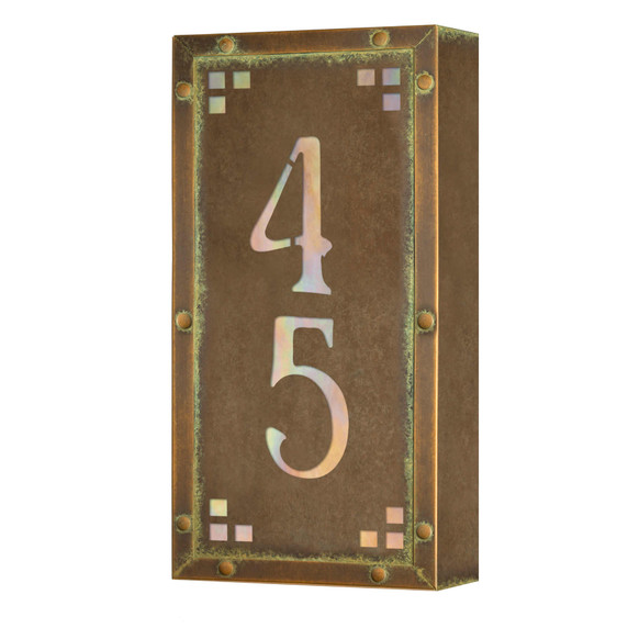  A solid brass, vertically oriented illuminated house number plaque with a two number address, a bronze finish, warm glass and corner glass accents.