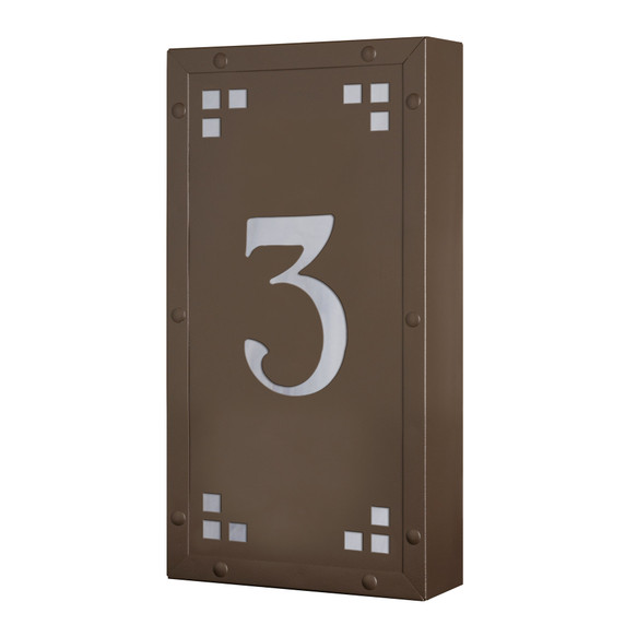  A solid brass, vertically oriented illuminated house number plaque with a single number address, a smooth bronze finish, white glass and corner glass accents.