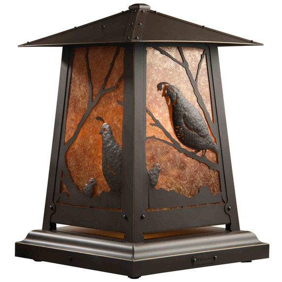  A beefy, rustic pedestal style table lamp with hammered metal quail artwork, an oil-rubbed bronze finish and amber toned mica panels instead of glass.