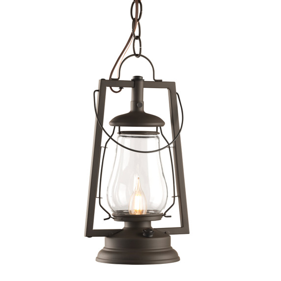  A rustic reproduction of a 19th-century, Dietz hot blast chain mounted pendant lantern from the frontier days of the Wild West with a warm bronze finish, clear glass shade and flame bulb.