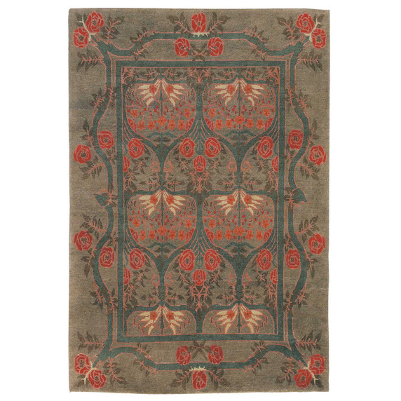  A Victorian or English Arts & Crafts style rug with a stylized rose border. The dominant colors are greens with red accents. It is handmade by the artisans at Tiger Rug.