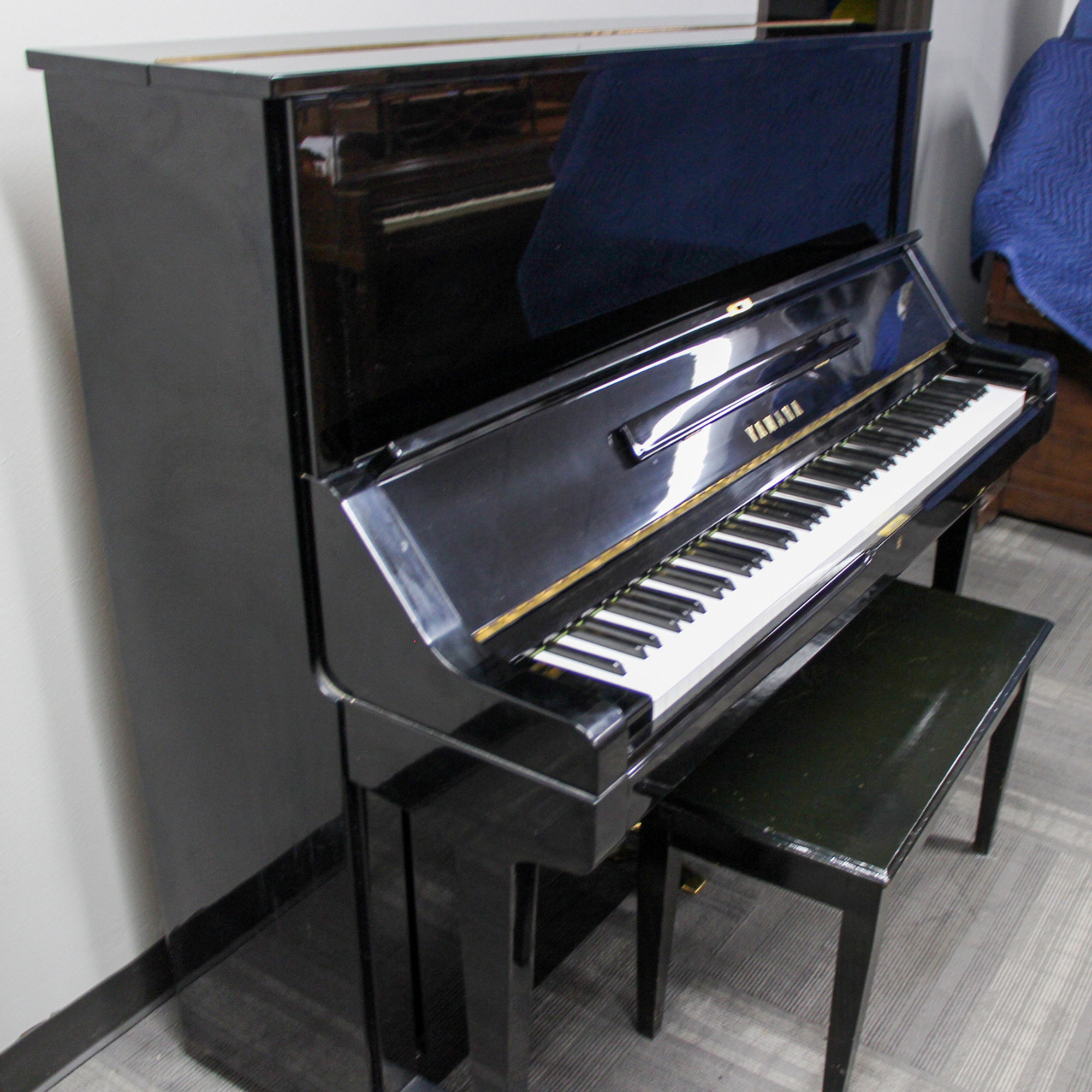 upright piano with 2 windows on top