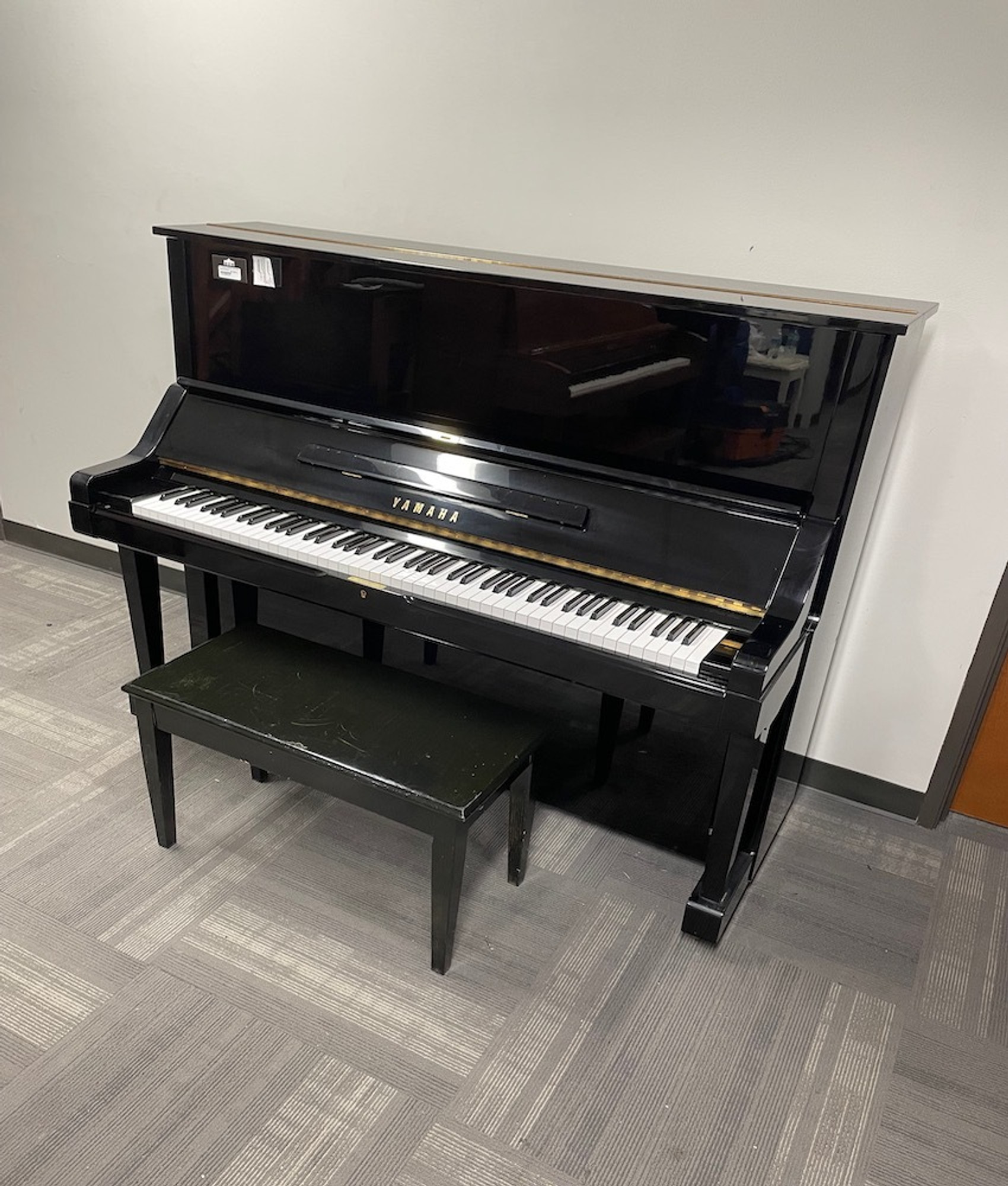 upright piano with 2 windows on top