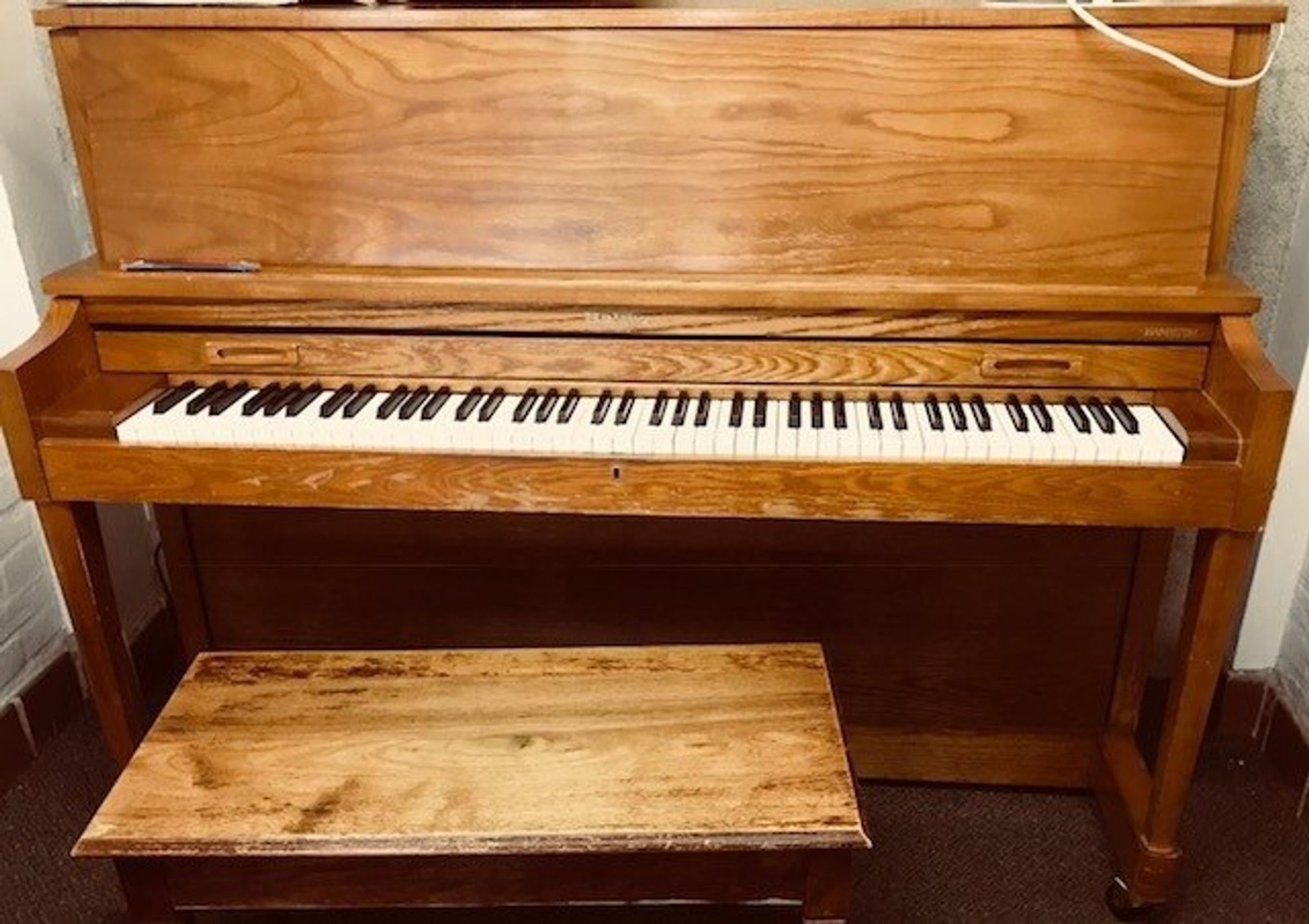 oak player piano with 2 windows on top