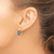 Image of 16mm 14K Yellow Gold 7x5mm Emerald-cut Blue Topaz Leverback Earrings