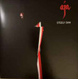 Steely Dan ‎– Aja
Label:
Geffen Records ‎– B0035028-01, UMe ‎– B0035028-01
Format:
Vinyl, LP, Album, Reissue, Remastered, Stereo, Gatefold, 180g
Country:
Worldwide
Released:
29 Sep 2023
Genre:
Jazz, Rock, Pop
Style:
Pop Rock, Fusion
Aja (Vinyl, LP, Album, Reissue, Remastered, Stereo) for sale
More Images

Tracklist
Position	Title/Credits	Duration
A1	Black Cow
Backing Vocals – Clydie King, Rebecca Louis, Sherlie Matthews, Venetta Fields
Bass – Chuck Rainey
Clavinet – Joe Sample
Drums – Paul Humphrey
Electric Piano – Victor Feldman
Guitar – Larry Carlton
Synthesizer – Donald Fagen
Tenor Saxophone – Tom Scott
5:07
A2	Aja
Backing Vocals – Donald Fagen, Tim Schmit*
Bass – Chuck Rainey
Drums – Steve Gadd
Electric Piano – Joe Sample
Guitar – Denny Dias, Larry Carlton, Walter Becker
Percussion – Victor Feldman
Piano – Michael Omartian
Synthesizer, Whistle [Police] – Donald Fagen
Tenor Saxophone – Wayne Shorter
7:56
A3	Deacon Blues
Backing Vocals – Clydie King, Sherlie Matthews, Venetta Fields
Bass – Walter Becker
Drums – Bernard Purdie
Electric Piano – Victor Feldman
Guitar – Larry Carlton, Lee Ritenour
Synthesizer – Donald Fagen
Tenor Saxophone – Pete Christlieb
7:26
B1	Peg
Backing Vocals – Michael McDonald, Paul Griffin
Bass – Chuck Rainey
Clavinet – Don Grolnick
Drums – Rick Marotta
Electric Piano – Paul Griffin
Guitar – Steve Khan
Lyricon – Tom Scott
Percussion – Gary Coleman, Victor Feldman
Soloist [Guitar] – Jay Graydon
3:58
B2	Home At Last
Backing Vocals – Donnald Fagen*, Tim Schmit*
Bass – Chuck Rainey
Drums – Bernard Purdie
Guitar – Larry Carlton
Piano, Vibraphone [Vibes] – Victor Feldman
Soloist [Guitar] – Walter Becker
Synthesizer – Donald Fagen
5:31
B3	I Got The News
Backing Vocals – Clydie King, Michael McDonald, Rebecca Louis, Sherlie Matthews, Venetta Fields
Bass – Chuck Rainey
Drums – Ed Greene (2)
Guitar – Dean Parks
Piano, Vibraphone [Vibes], Percussion – Victor Feldman
Soloist [Guitar] – Larry Carlton, Walter Becker
Synthesizer – Donald Fagen
5:03
B4	Josie
Backing Vocals – Donald Fagen, Tim Schmit*
Bass – Chuck Rainey
Drums – Jim Keltner
Electric Piano – Victor Feldman
Guitar – Dean Parks, Larry Carlton
Percussion – Jim Keltner
Soloist [Guitar] – Walter Becker
Synthesizer – Donald Fagen