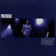 Portishead ‎– Dummy
Label:
Go! Beat ‎– 3797205, Island Records ‎– 3797205
Format:
Vinyl, LP, Album, Reissue, Repress, 180 Gram, Gatefold
Country:
Europe
Released:
 
Genre:
Electronic
Style:
Downtempo, Trip Hop
Dummy (Vinyl, LP, Album, Reissue, Repress) for sale
More Images

Tracklist
Position	Title/Credits	Duration
A1	Mysterons
Drums – Clive Deamer
Electric Piano [Rhodes] – Geoff Barrow
Guitar, Theremin – Adrian Utley
Written-By – A. Utley*, B. Gibbons*, G. Barrow*
4:56
A2	Sour Times
Electric Piano [Rhodes], Organ [Hammond] – Neil Solman
Guitar – Adrian Utley
Programmed By – Geoff Barrow
Written-By – A. Utley*, B. Gibbons*, G. Barrow*, H. Brooks*, L. Schifrin*, O. Turner*
4:05
A3	Strangers
Drums – Clive Deamer
Electric Piano [Rhodes] – Geoff Barrow
Guitar – Adrian Utley
Written-By – A. Utley*, B. Gibbons*, G. Barrow*, W. Shorter*
3:49
A4	It Could Be Sweet
Drum Programming – Richard Newell (3)
Electric Piano [Rhodes] – Geoff Barrow
Written-By – B. Gibbons*, G. Barrow*
4:10
A5	Wandering Star
Drums – Clive Deamer
Guitar – Adrian Utley
Organ [Hammond] – Gary Baldwin
Programmed By – Geoff Barrow
Written-By – M. Dickerson*, B. Gibbons*, CW Miller*, G. Barrow*, HR Brown*, H. Scott*, J. Goldstein*, L. Oskar*, L. Jordan*, S. Allen*
4:46
B1	Numb
Bass – Adrian Utley
Drums – Clive Deamer
Organ [Hammond] – Gary Baldwin
Programmed By, Drums – Geoff Barrow
Written-By – A. Utley*, B. Gibbons*, G. Barrow*
3:43
B2	Roads
Drums – Clive Deamer
Electric Piano [Rhodes] – Neil Solman
Guitar, Bass, Arranged By [Strings] – Adrian Utley
Nose Flute – Dave McDonald (2)
Programmed By, Arranged By [Strings] – Geoff Barrow
Strings – Strings Unlimited
Written-By – A. Utley*, B. Gibbons*, G. Barrow*
4:56
B3	Pedestal
Bass – Adrian Utley
Drums – Clive Deamer
Programmed By – Geoff Barrow
Trumpet – Andy Hague
Written-By – A. Utley*, B. Gibbons*, G. Barrow*
3:30
B4	Biscuit
Drums – Clive Deamer
Electric Piano [Rhodes] – Geoff Barrow
Written-By – B. Gibbons*, G. Barrow*, J. Ray*
4:34
B5	Glory Box
Guitar, Organ [Hammond] – Adrian Utley
Programmed By – Geoff Barrow
Written-By – A. Utley*, B. Gibbons*, G. Barrow*, I. Hayes*
4:49