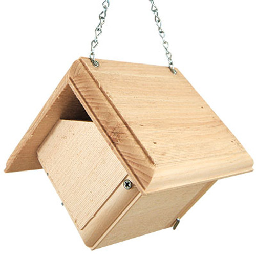 Invite melodious Carolina wrens into your backyard bird garden with the Coveside Carolina Wren Bird House. These active birds share their songs throughout the day, and offering them this comfortable domicile provides them a safe dwelling you can observe right in your backyard. Much like house wrens, Carolina wrens don't mind a house that sways, and the aged pine construction of this unit is sustainably sourced to give you an exceptional and durable roost for these feathered friends. The pitched roof overhangs the body of the house on all sides, protecting the interior from rain and harsh weather. Extended ventilation slots along the sides of the roof keep the internal temperature of the home cozy and well regulated, while a pair of angled corners at the base of the house offer drainage to the nest, keeping it dry. The abode's wide opening specifically accommodates large sticks, giving wrens the chance to bring their material in for a comfortable nest, and the rough hewn pine lets nestlings get a reliable grip when they are trying to exit the box. One side panel lifts upward for easy cleaning and nest checks, and a small metal latch in the corner keeps the shelter securely closed. The 0.75" thick panels lend ideal insulation to the home, while the light color of the unfinished pine assists in keeping it cool during the summer. This unit will age to a graceful and fetching gray tone over time and with exposure to the elements, providing dynamic beauty to your backyard ​décor. Use the attached chain to easily hang this house from a tree branch or wall bracket for a dazzling, quaint showcase. Offer a comfortable roost that appeals to Carolina wrens with this Carolina Wren Bird House. Made in the USA.

Opening: 2.75"W x 1.25"H
Dimensions: 7.5"L x 7.5"W x 7.125"H
Mounting: may be hung
Construction: pine
Shipping Weight: 3 lbs