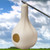 Wild Bird Lover's Single Purple Martin Gourd
Bring a nature-inspired, time tested shelter to your bird garden with this Wild Bird Lover's Single Purple Martin Gourd. Dried, hollowed gourds were successfully used in centuries past as housing for migratory purple martins, and the extended neck and rounded body of this roost perfectly evokes this shape. Alternating raised and impressed elements at the flared end of the neck lend fantastic texture and a natural appeal to this piece, while a 2.125" diameter entry hole provides safe passage for martins. This leads to a 6.25" diameter, interior nesting area, deep enough for birds to place eggs near the back, away from predators. A drainage hole on the slightly flattened base helps the home and compartment remain dry, while the beige tone keeps fledglings cool in the summer. Readily suspend this gourd using its integrated top loop; it can either be placed below an existing house, or situated on a gourd rack system for a different look. Its molded, plastic body is simple to maintain and clean for use again and again, while offering lasting shelter to your feathered friends. Increase the nesting options for your martin colony with this Single Purple Martin