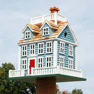 Home Bazaar Nantucket Colonial Bird House
Bring an elegant, seaside retreat to any setting with this Home Bazaar Nantucket Colonial Bird House. This highly detailed and colorful shelter adds a delightfully architectural look to your bird garden at once. The rectangular frame and wealth of window shapes replicates the traditional, sprawling Colonial homes commonly found in Nantucket. The white on the fence around the perimeter of the item, around each faux window, and on the generous widow's walk atop the roof perfectly contrasts the soft blue color of the home, while the bright red door completes the piece. Two dormers and a chimney shape also adorn the pitched roof, and its cedar shingles create a truly remarkable home. A 1.25" diameter entry hole rests on two sides of the home, creating two separate compartments for birds to roost. The deep design of the shelter keeps nestlings protected from predators, and screening beneath the entry holes allows birds to easily exit when ready. The generous back panel removes for cleaning and nest checks, and a gap at the top of this panel keeps the home nicely ventilated. Two drainage holes on the significant base ensure any captured water exits the nest, and its green color mimics grass for a fun hint. Attach a mounting plate (not included) to this platform to post mount the item in moments. The wooden body is perfect for your feathered friends, while the vividly painted exterior captures attention. Offer your favorite backyard birds a striking retreat with this Nantucket Colonial Bird House.

Note: Climate and the elements will weather this home and change its appearance over time; however, weathering will add to the item's natural charm without compromising its function. Should you want to preserve the finish (paint) of this house, you should cover it with several layers of a polyurethane product that is recommended for marine use (UV Rated) that will not turn the white paint yellow. You should expect that once left outside, the item will weather and require refinishing. This item may be painted to match your aesthetic for a custom finish.

Openings: 1.25" dia.
Dimensions: 14.5"W x 11"D x 17.5"H
Mounting: post mount
Construction: wood
Shipping Weight: 13 lbs