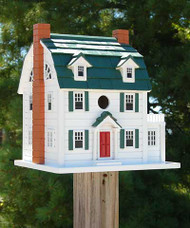 Home Bazaar Dutch Colonial Bird House
Invite birds to frequent your yard by placing the Home Bazaar Dutch Colonial Bird House in it. The gambrel roof, distinctive faux windows, and dual dormers lend a classic, familiar look to this unit, and its white and green colors offer a natural hint. Faux chimneys flank the home, their orange color contrasting the white siding and green roof. The generous home provides plenty of room for an avian family, and its bevy of window shapes enhances the spacious feel. A 1.25" diameter opening rests above the red door, for birds to easily access the home, and the gambrel roof overhangs this entry slightly to protect it from rain. This overhang also creates a ventilation gap on both the front and back of the home, ensuring it remains comfortable for nestlings. They may reach the top opening to exit the unit using the attached screening as a ladder, and the portico offers them a takeoff or landing spot. Two drainage holes on the base of the roost help any captured water escape the nest, and this significant platform also allows the item to be mounted to a post or pole with a mounting bracket (not included). The wooden construction enhances the classic lines, while the color scheme heightens the style. Place a timeless abode in your bird garden using this Dutch Colonial Bird House.

Note: Climate and the elements will weather this house and change its appearance over time; however, weathering will add to the home's natural charm without compromising its function. Should you want to preserve the finish (paint) of this item, you should select a polyurethane product that is recommended for marine use (UV Rated) that will not turn the white paint yellow. You should expect that once left outside, the home will weather and require refinishing.

Opening: 1.25" dia.
Dimensions: 12.625"W x 10.625"D x 13.5"H
Mounting: post mount
Construction: wood
Shipping Weight: 9 lbs