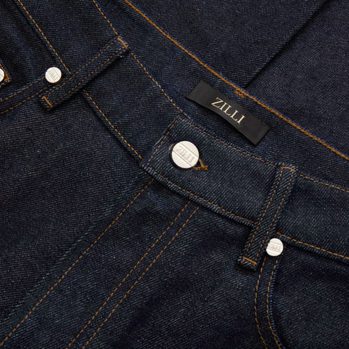 Raw blue jeans, wide fit, camel stitching