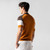 Orange zipped polo shirt, chocolate and white color-block