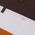 Orange zipped polo shirt, chocolate and white color-block